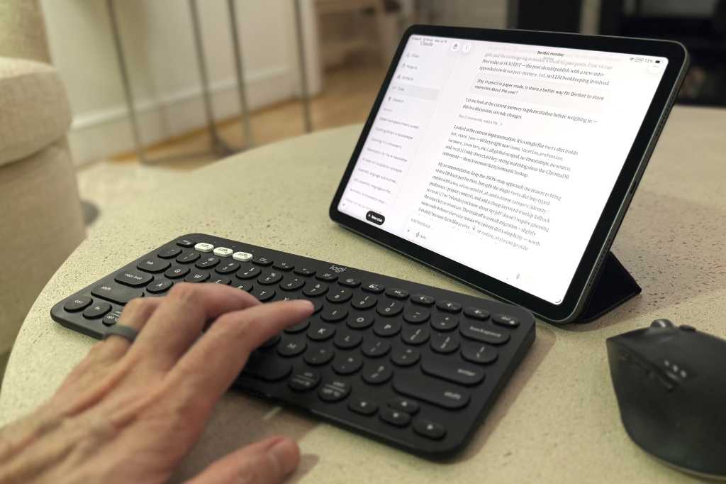 Claude Code on a table with a keyboard